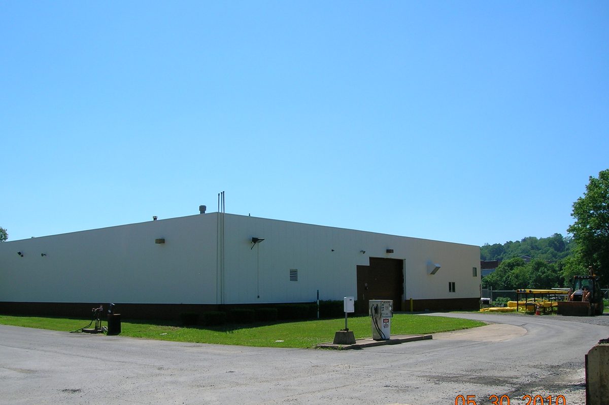 A commercial building with a clean, uniform refinished exterior — the finish we deliver